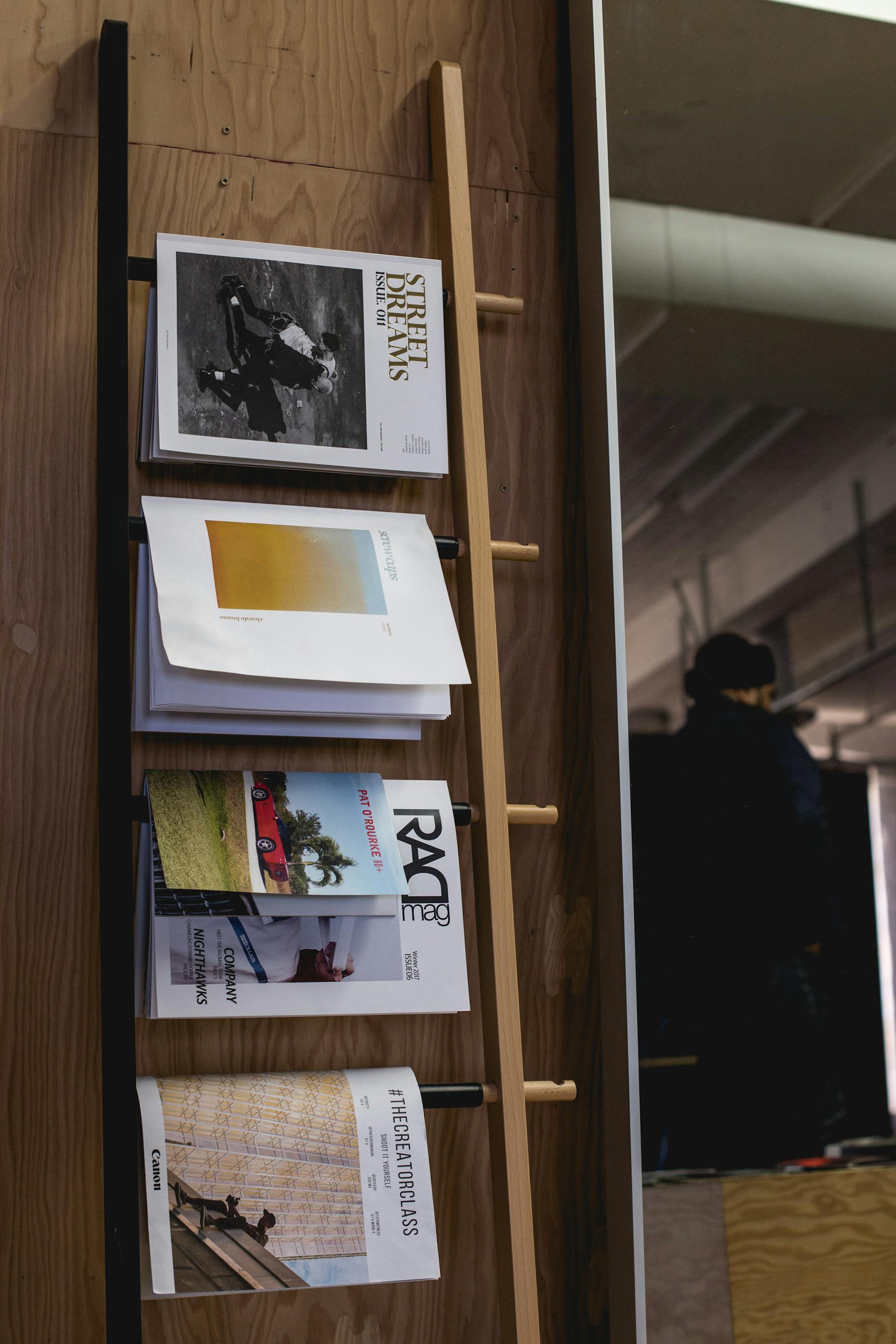 Editorial publications displayed on a ladder rack